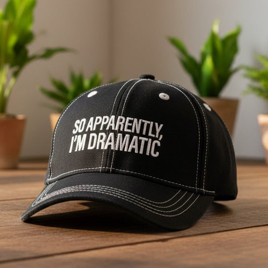 Black cap with white text 'SO APPARENTLY, I'M DRAMATIC'